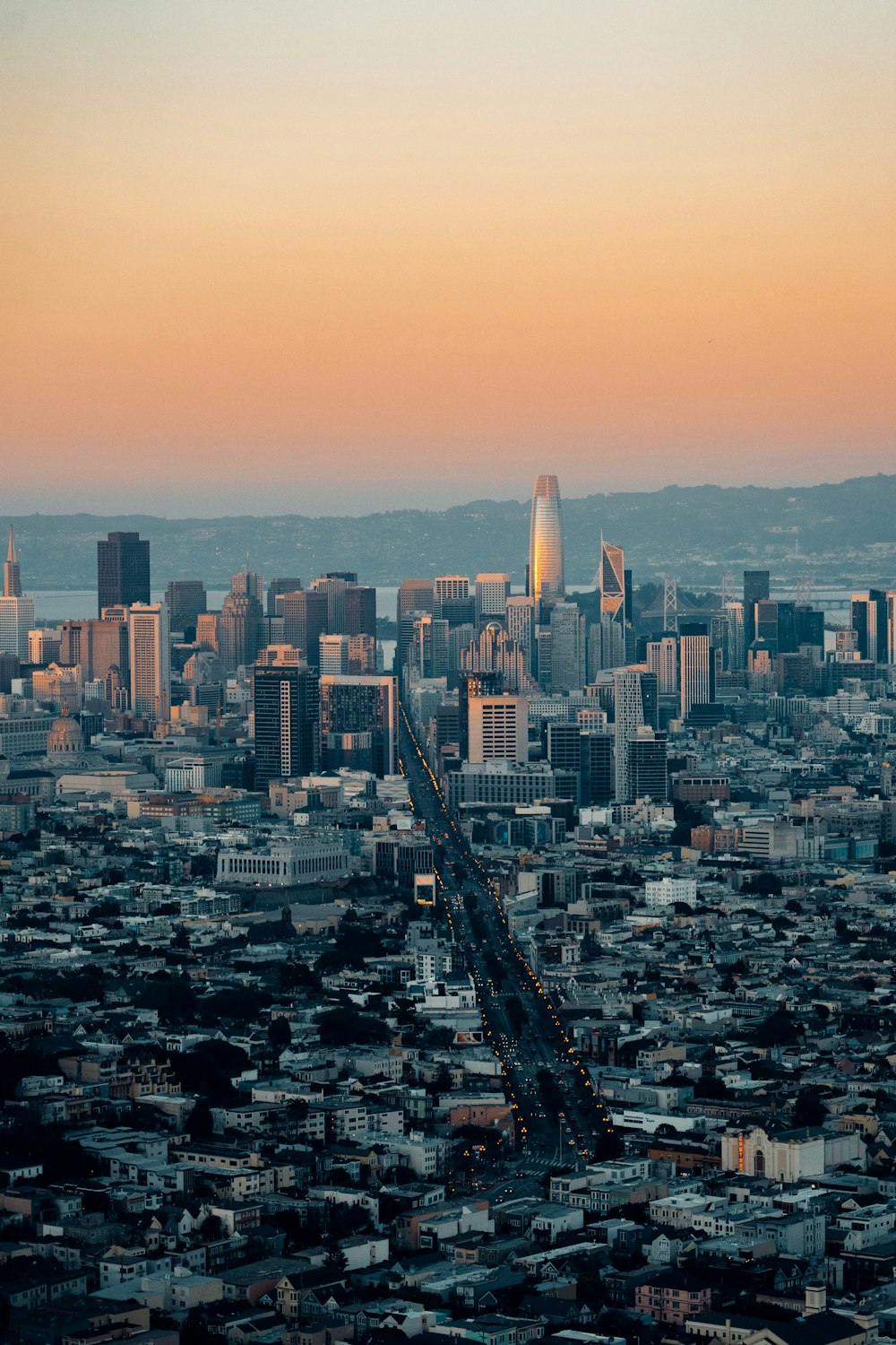 an aerial view of a city at sunset