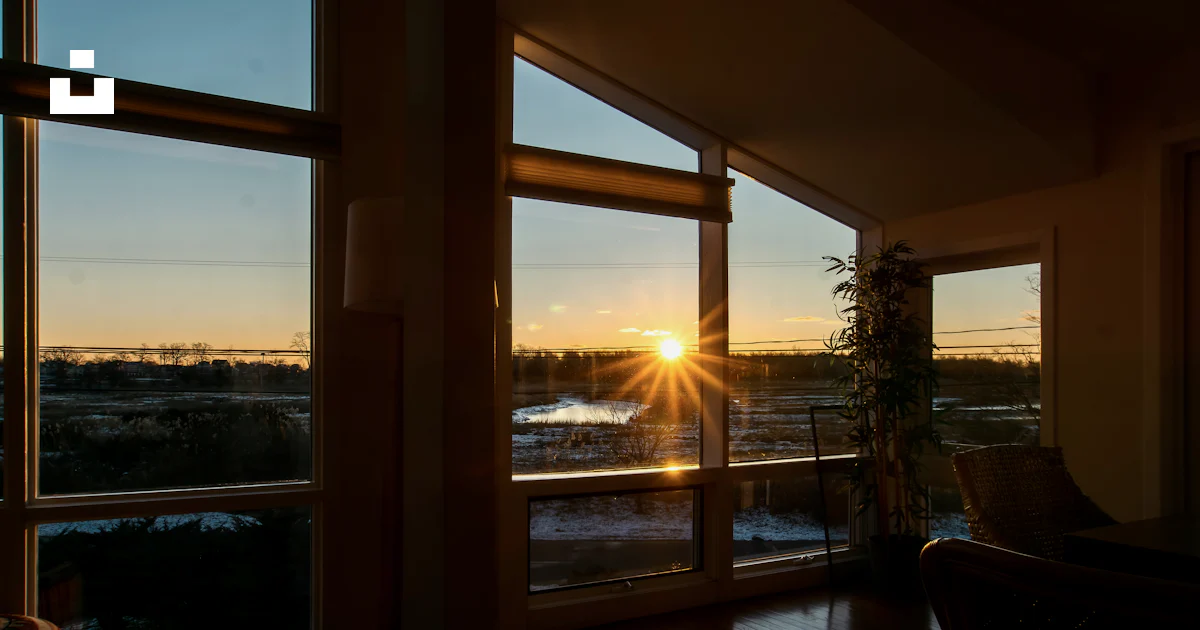 The sun is setting through the windows of a house photo – Free Norwalk ...