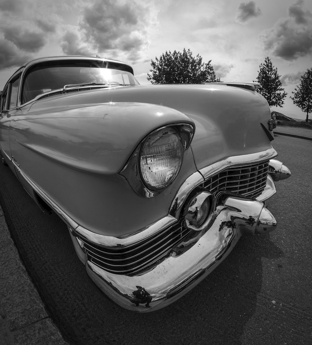 a black and white photo of an old car