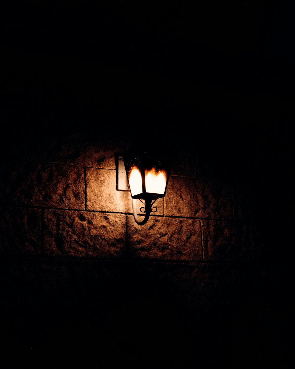 a street light is lit up in the dark