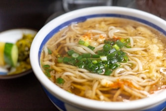 a bowl of noodle soup on a table