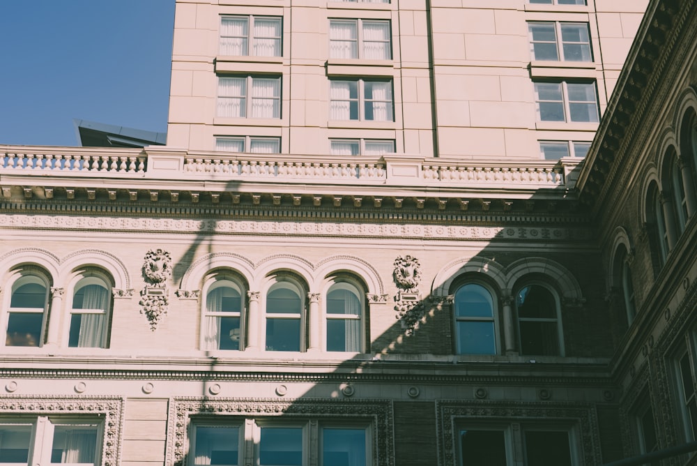 a tall building with a clock on the front of it