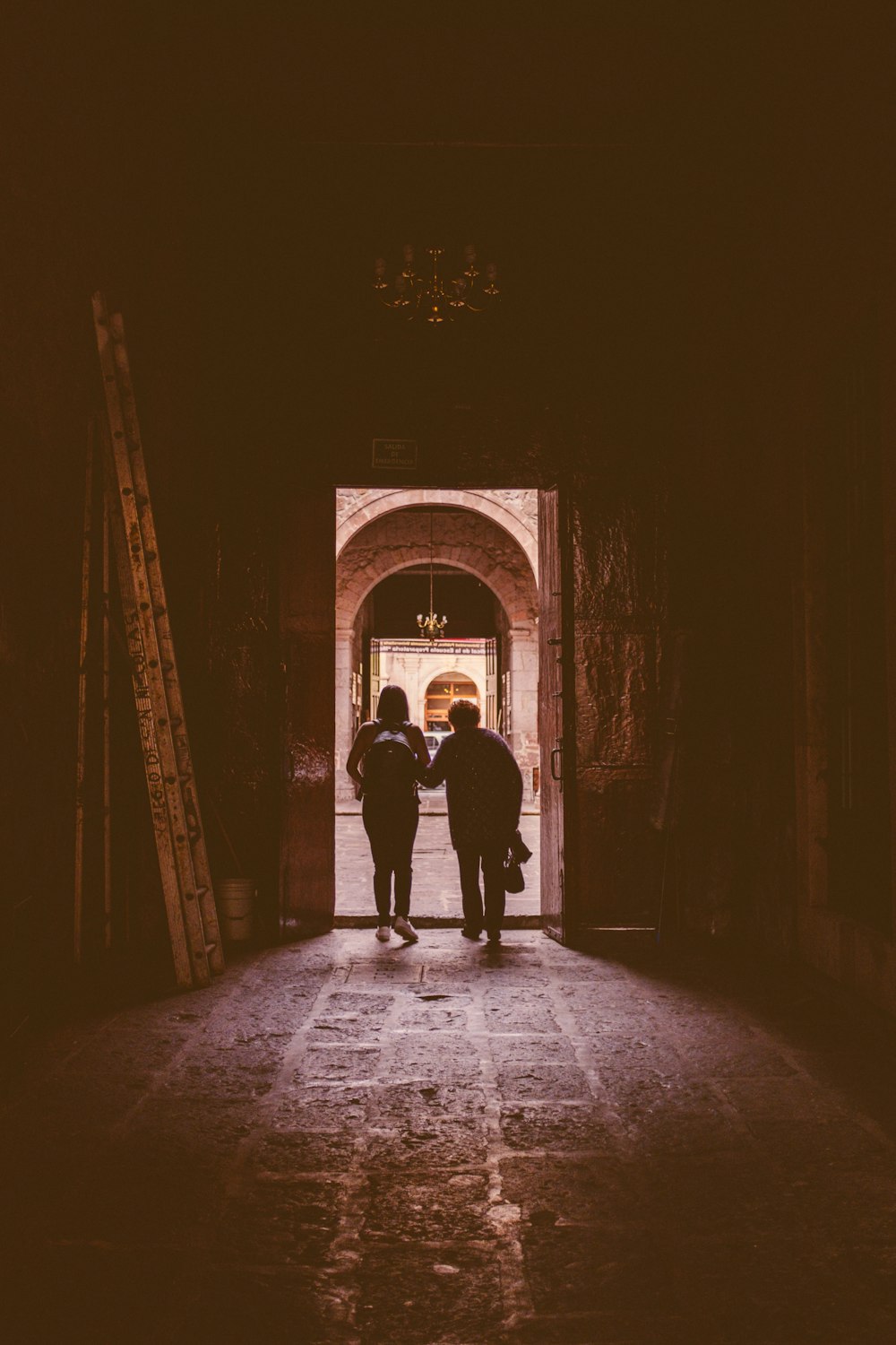 a couple of people that are standing in a doorway