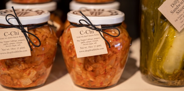 Jars of pickles and cucumbers with labels on them