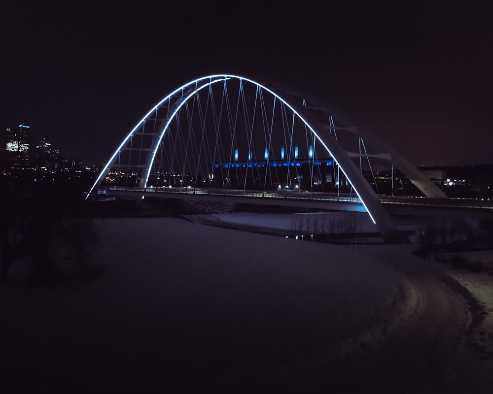 a bridge that is lit up at night