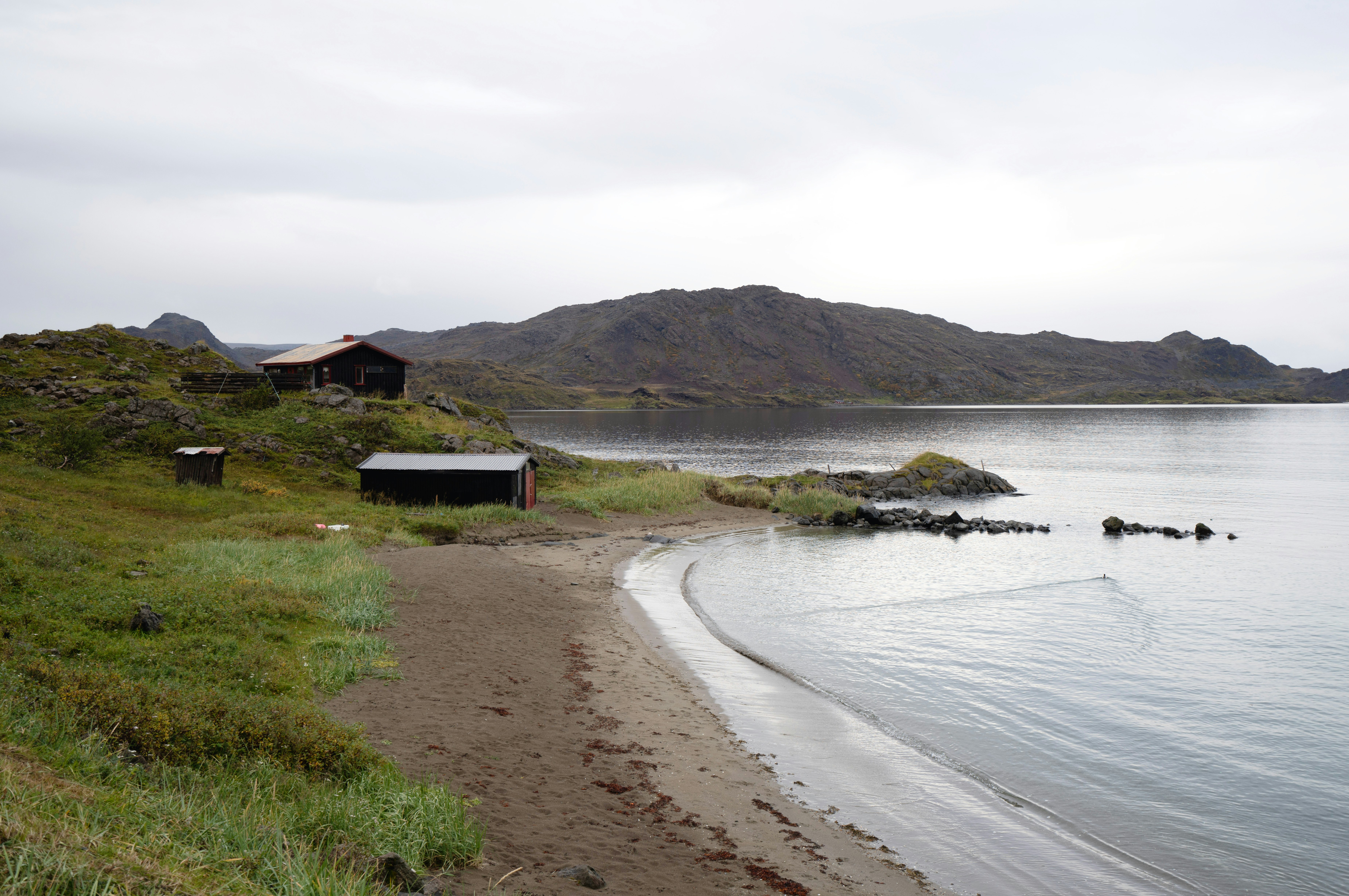 a house on the shore of a body of water
