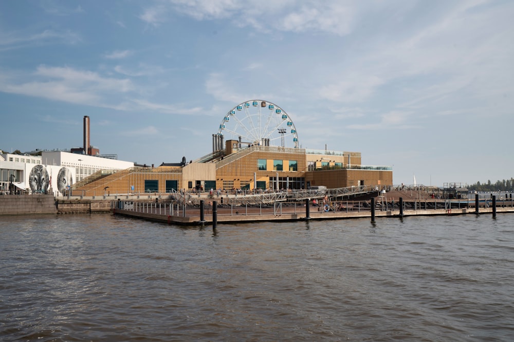 a pier with a ferris wheel in the background