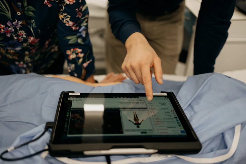 Healthcare professional reviewing clinical data on a tablet