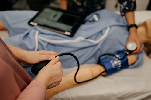 a person laying on a bed with a stethoscope
