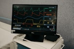 a monitor is on a stand in a room