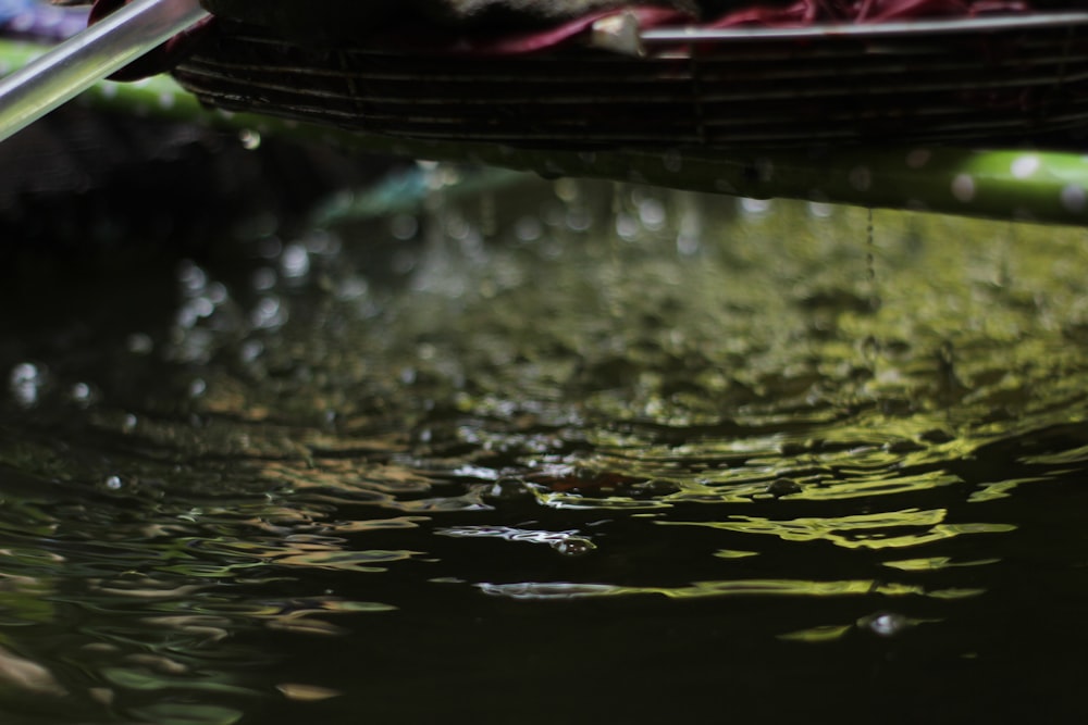 a close up of water with a basket in the background