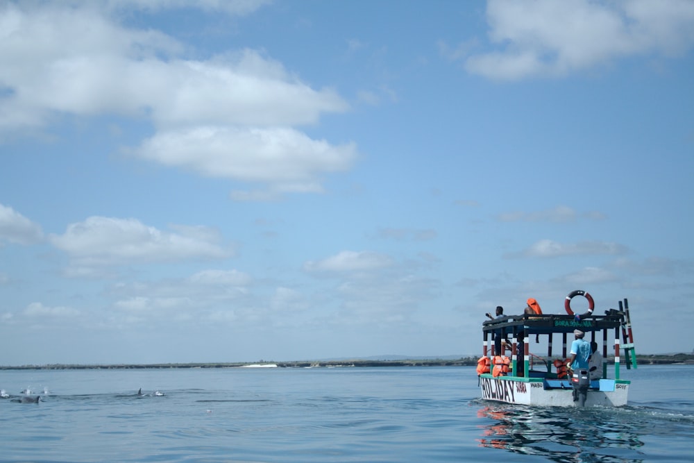 a boat with people on it in the water