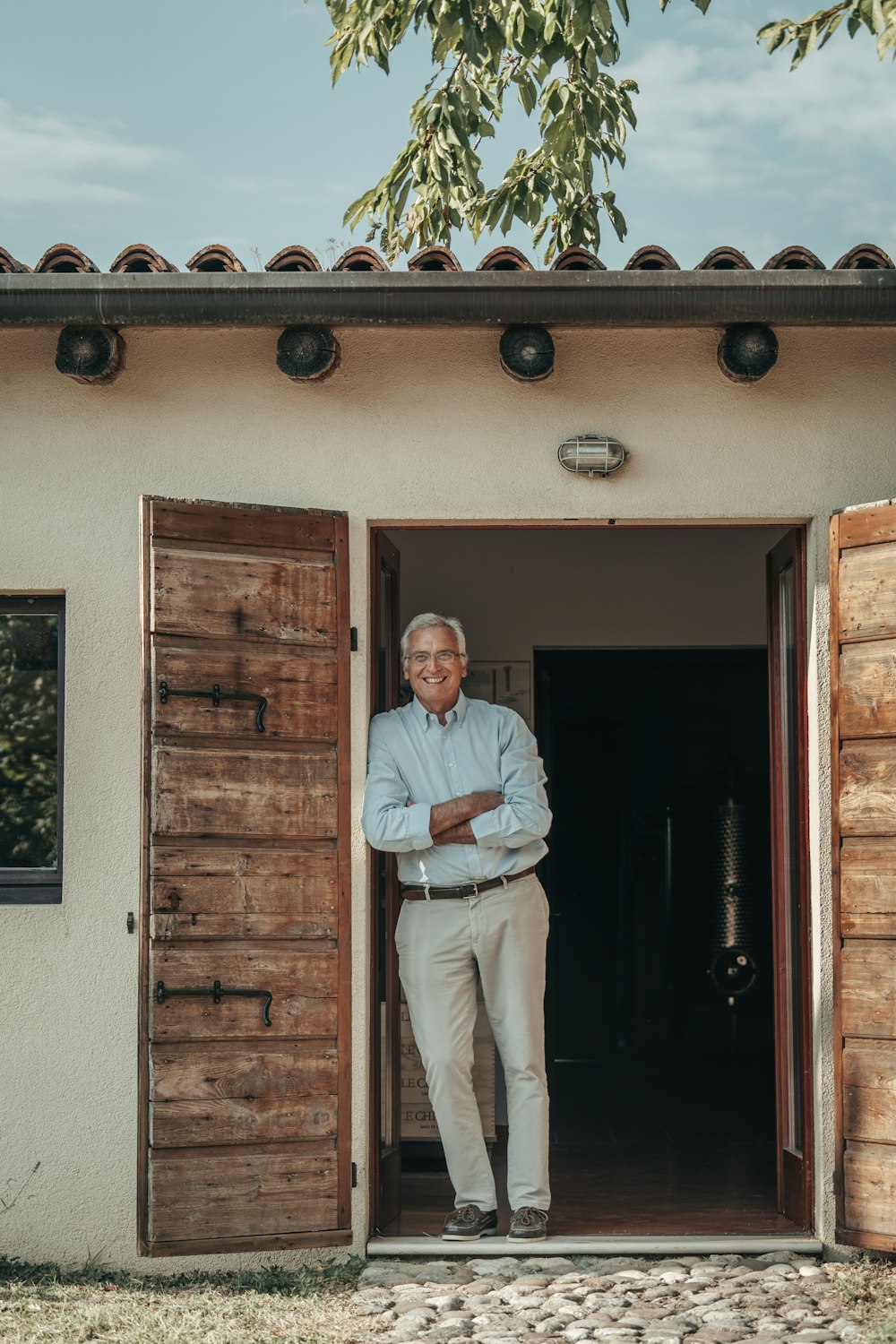 a man standing in a doorway of a building