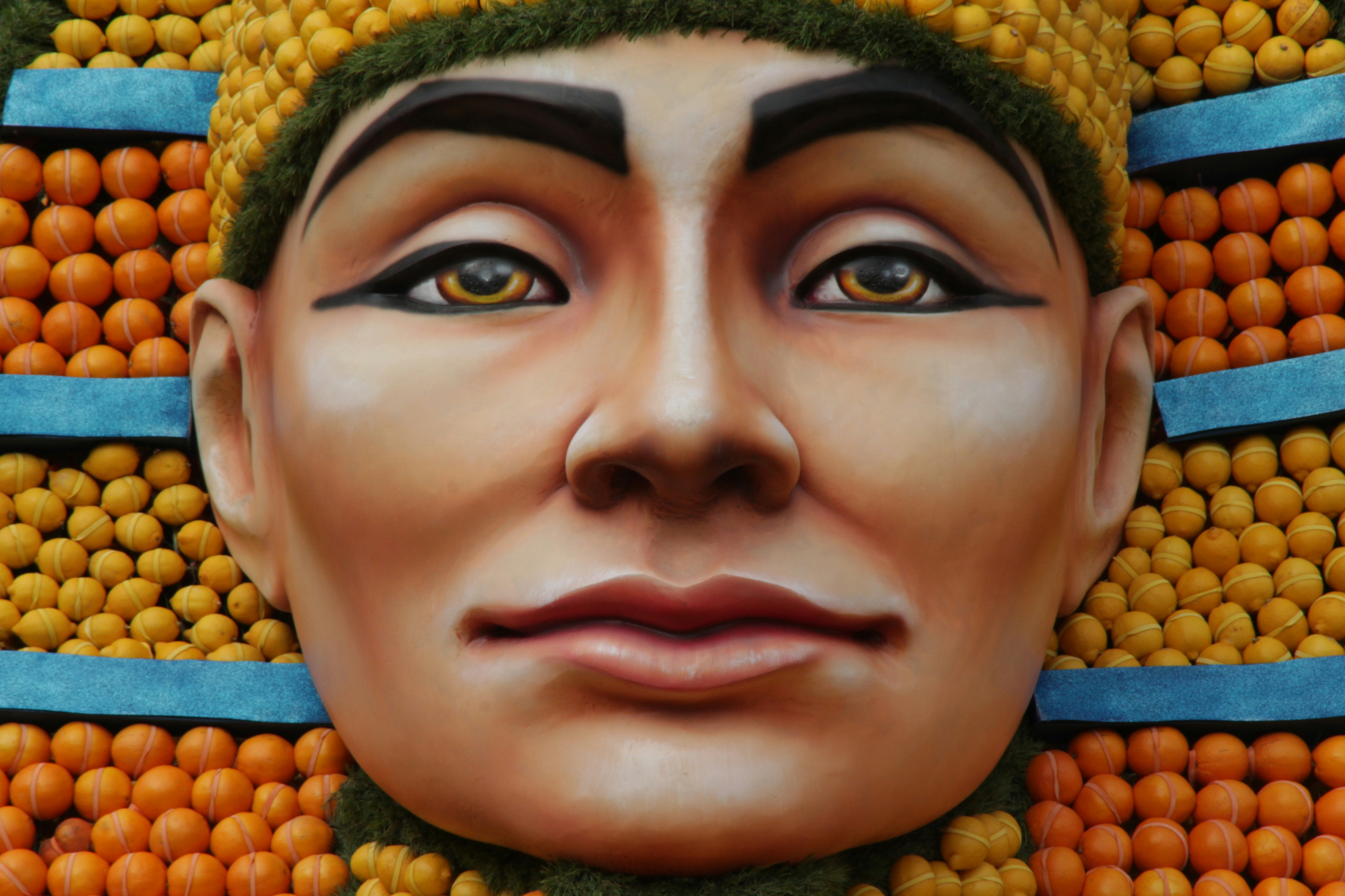 a close up of a face made out of oranges