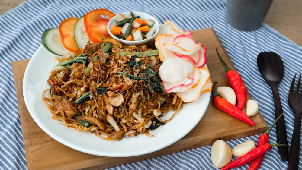 a plate of food on a table with utensils