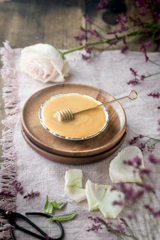 Close-up of traditional injera bread with honey wine in a rustic Ethiopian setting.