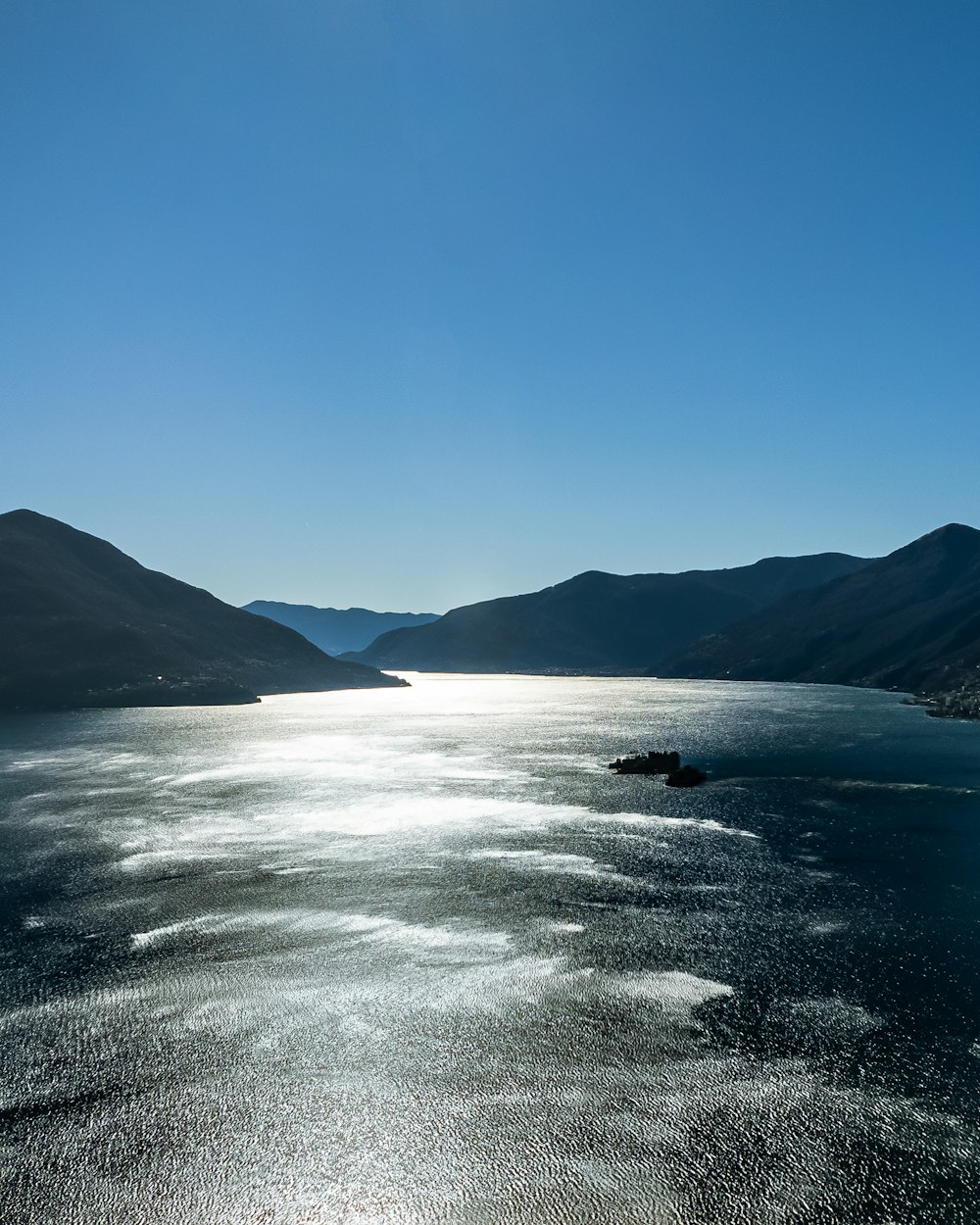 a large body of water surrounded by mountains