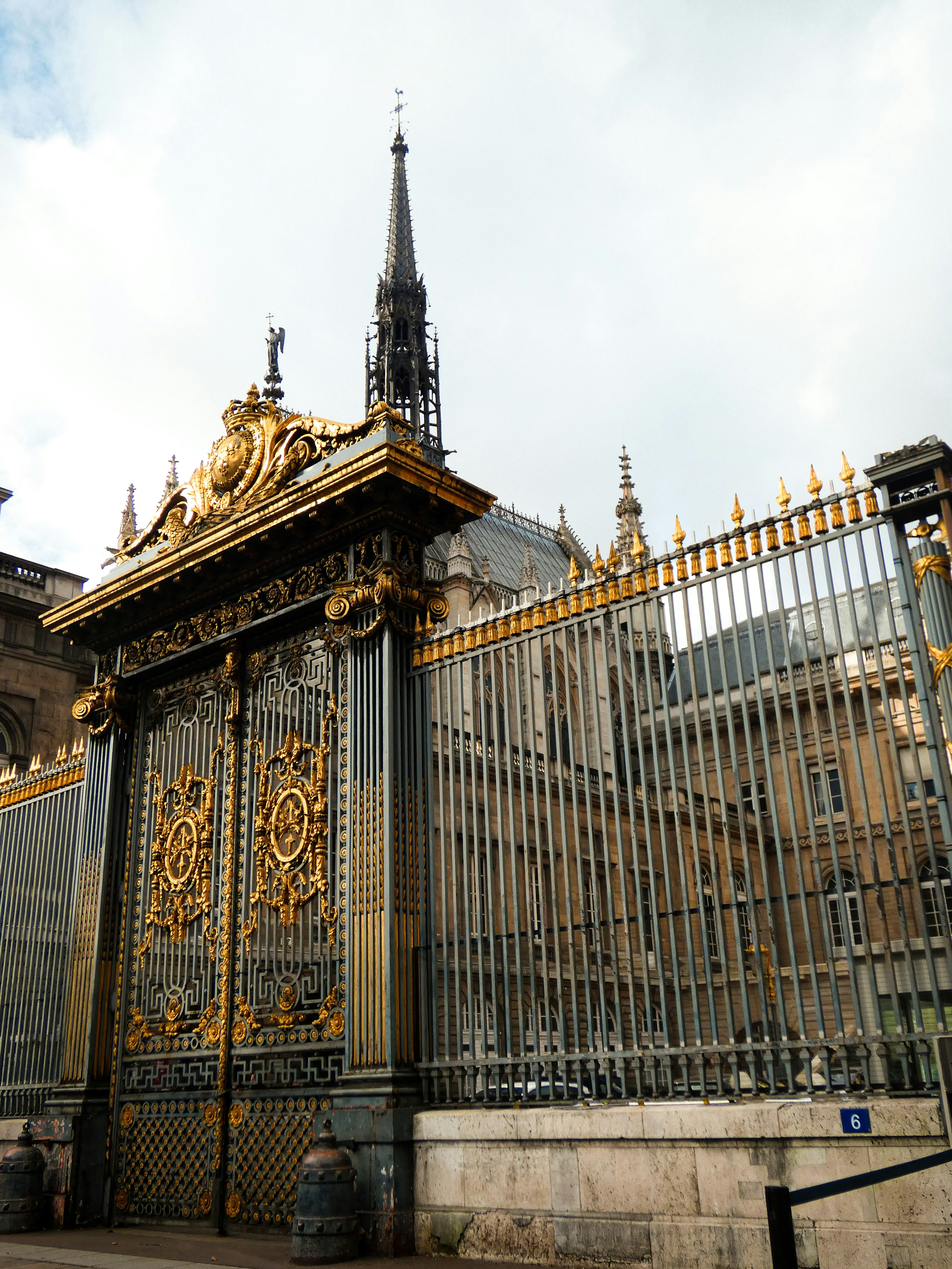 A golden gate with a clock on top of it photo – Free Building Image on ...