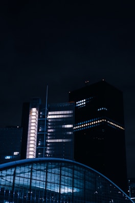 a very tall building sitting next to a very tall building