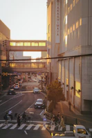 A bustling city street captured at sunset with warm light.