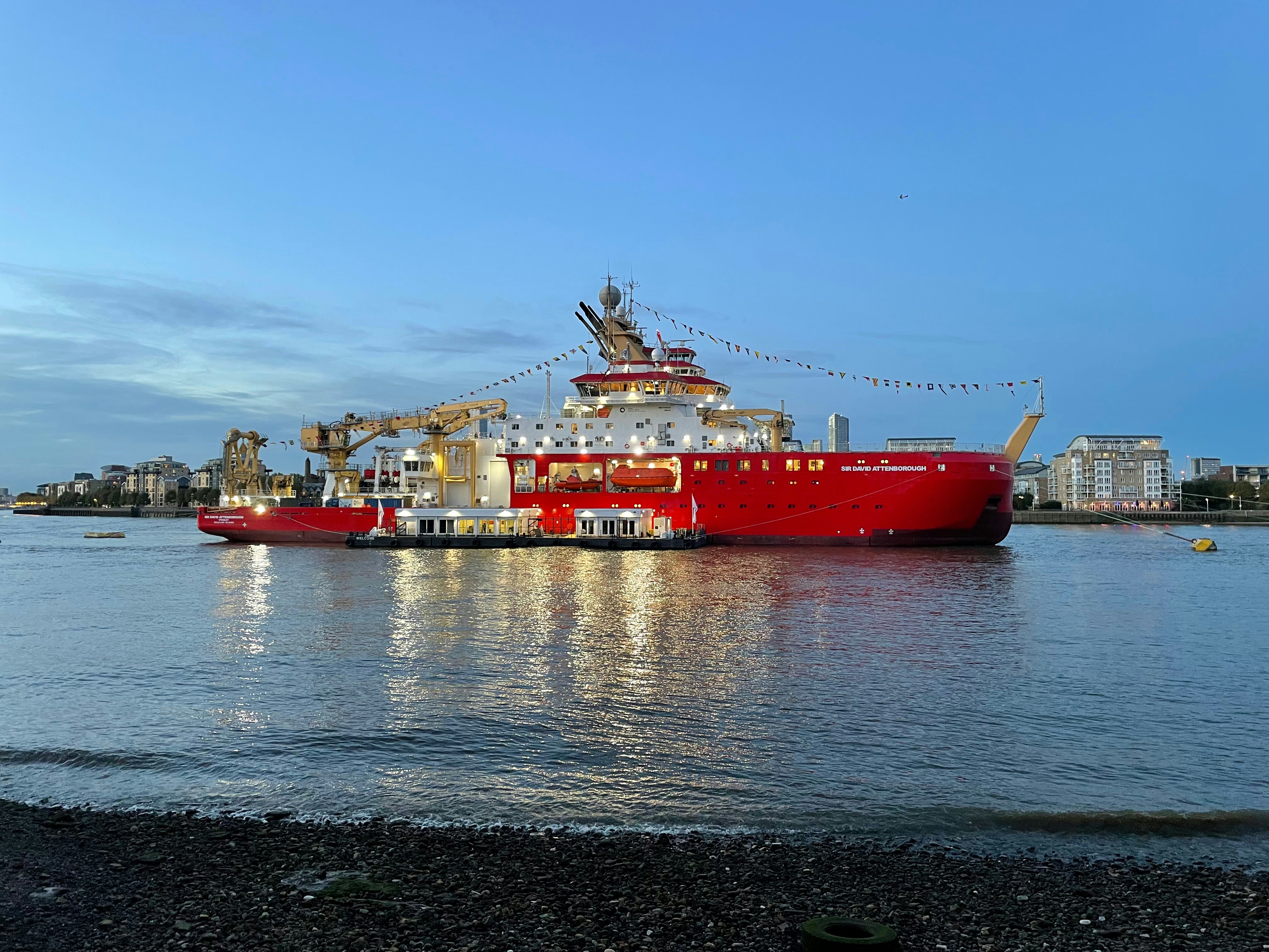 A large red boat in a body of water photo – Free Water Image on Unsplash