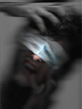 a blurry photo of a person with a blindfold