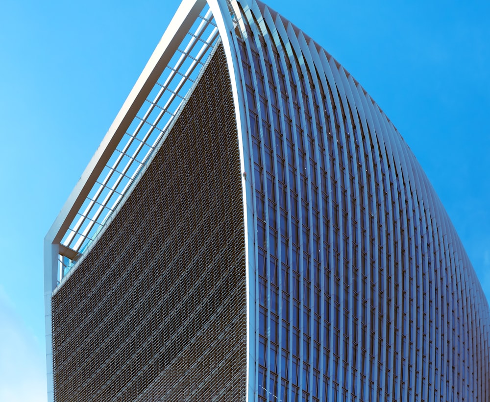 a very tall building with a curved roof