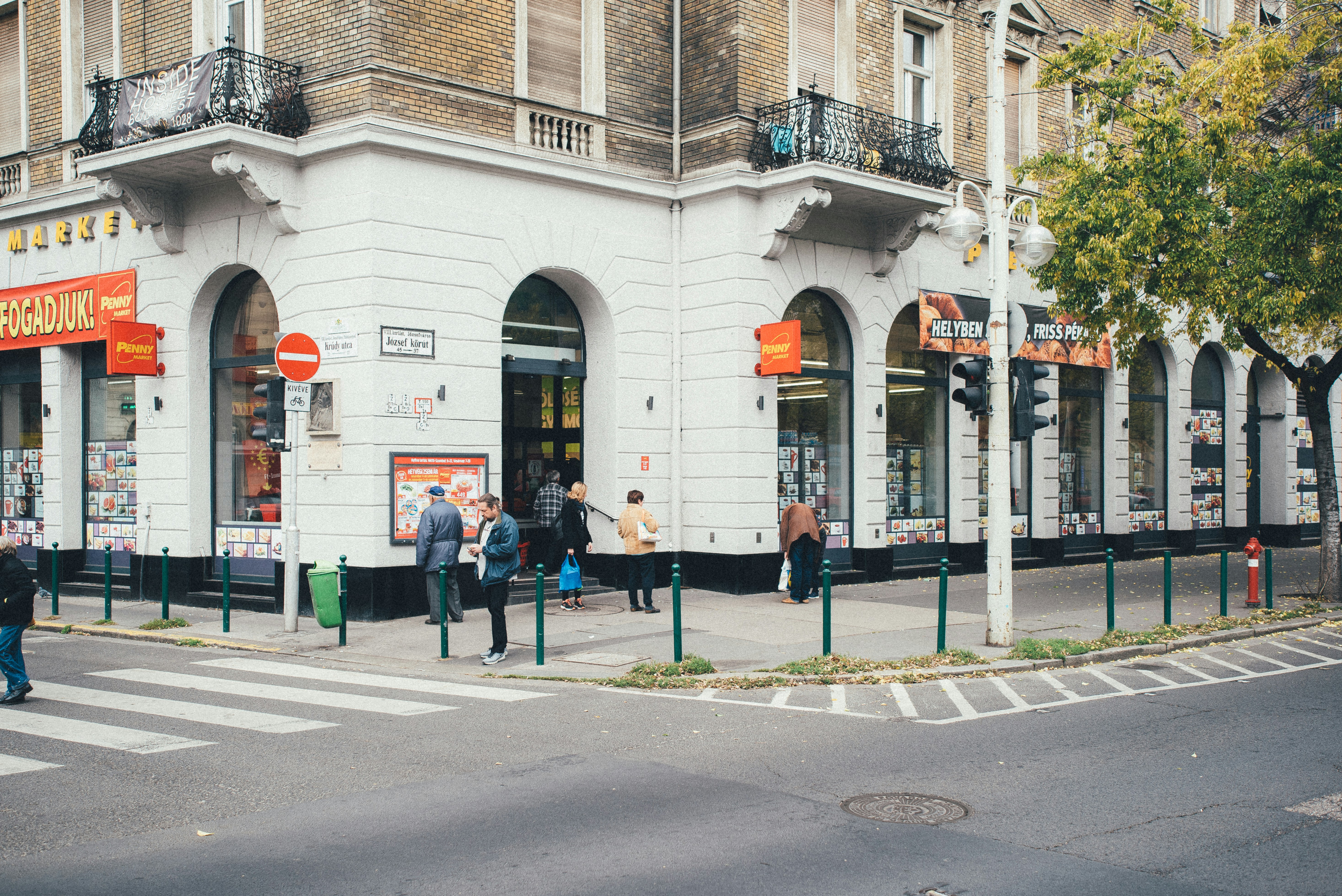 a group of people standing outside of a building