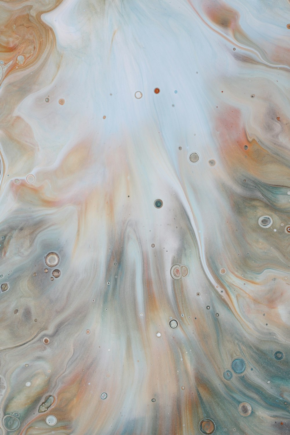 a close up of an abstract painting with lots of bubbles