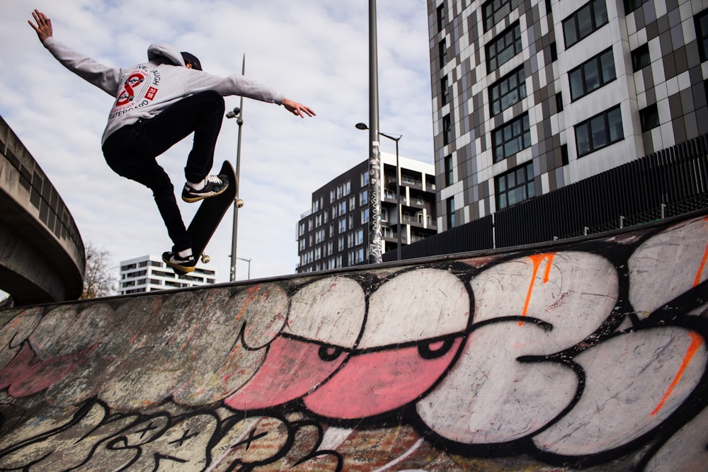 a man riding a skateboard up the side of a ramp