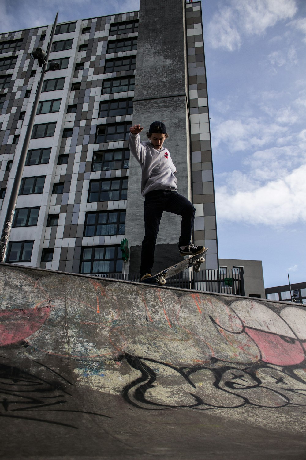 a man riding a skateboard up the side of a ramp