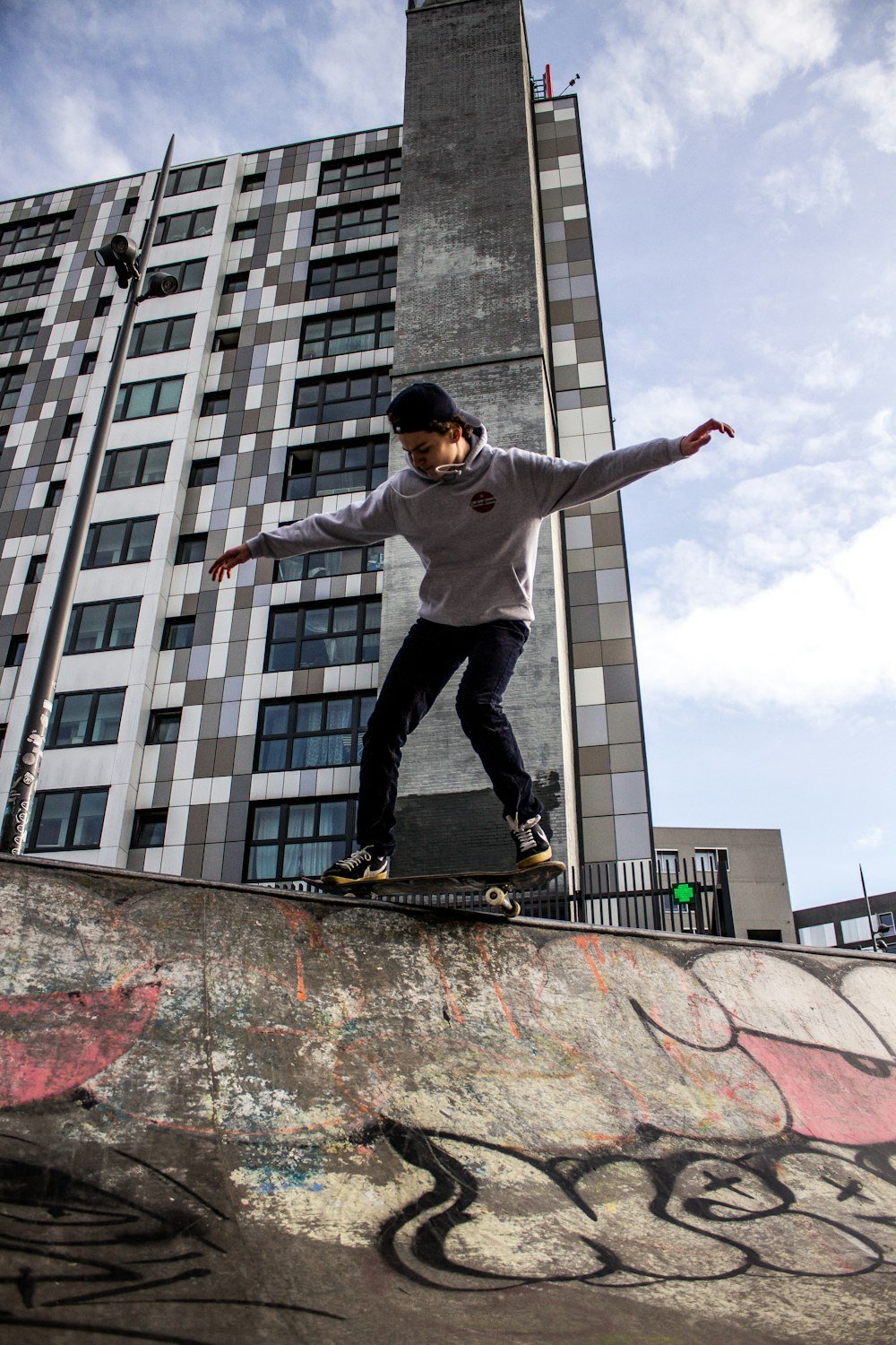 a man riding a skateboard up the side of a ramp