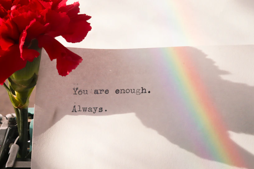 A serene pastel gradient background with a softly glowing affirmation card that reads 'You are enough.'