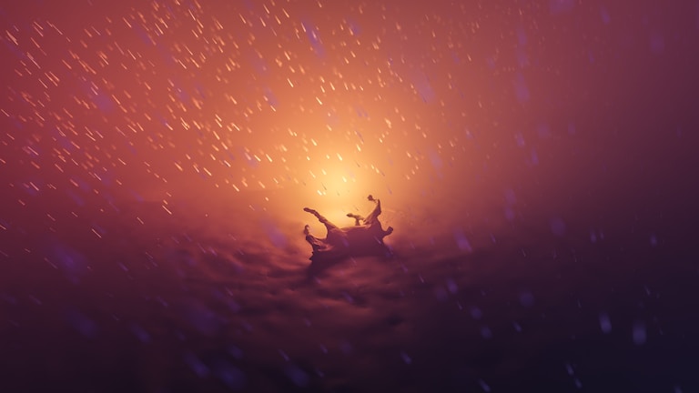 A dramatic scene featuring a silhouetted figure falling through a glowing and swirling atmospheric environment. The background is filled with vibrant orange and purple hues, reminiscent of a fiery or mystical setting. Particles or sparks seem to float around, enhancing the dynamic and surreal nature of the scene.