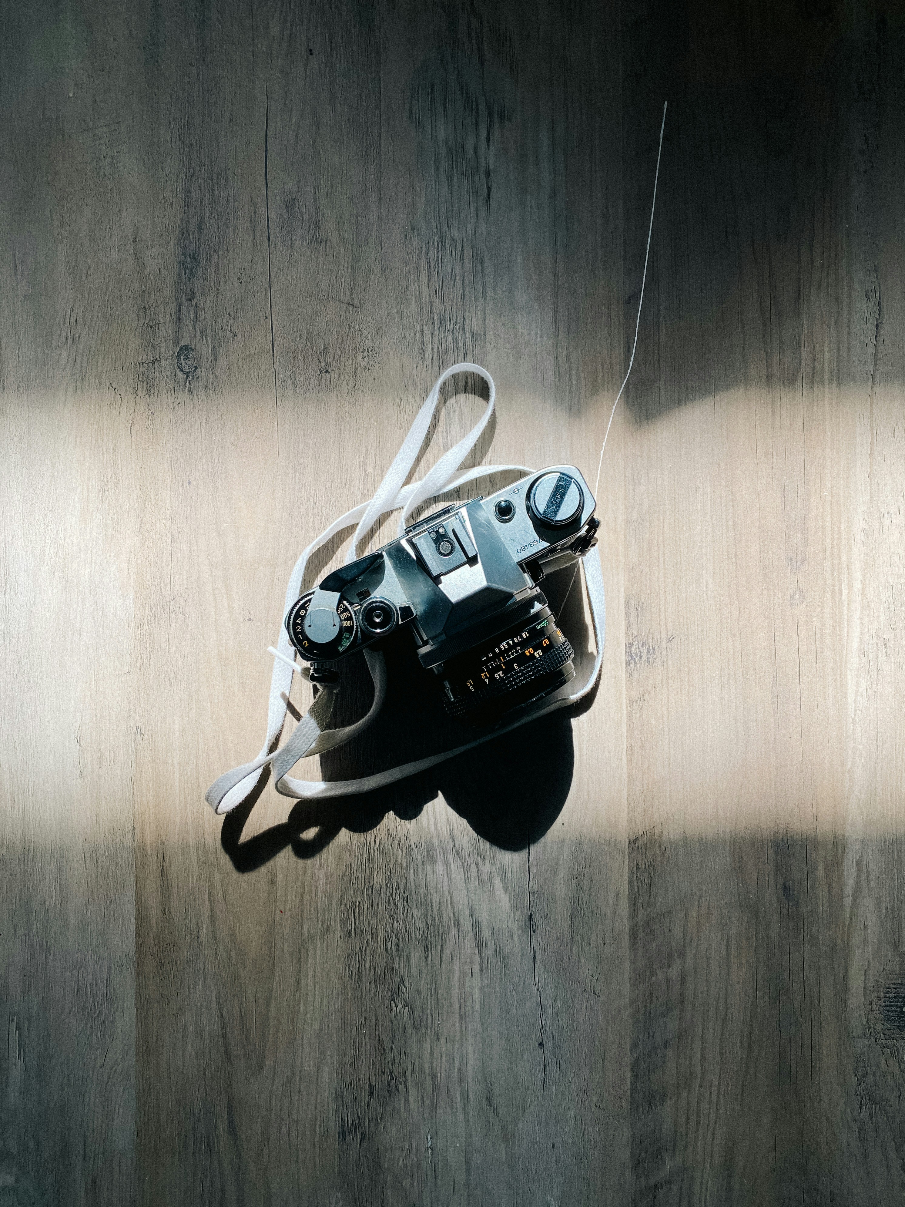 a camera sitting on top of a wooden table