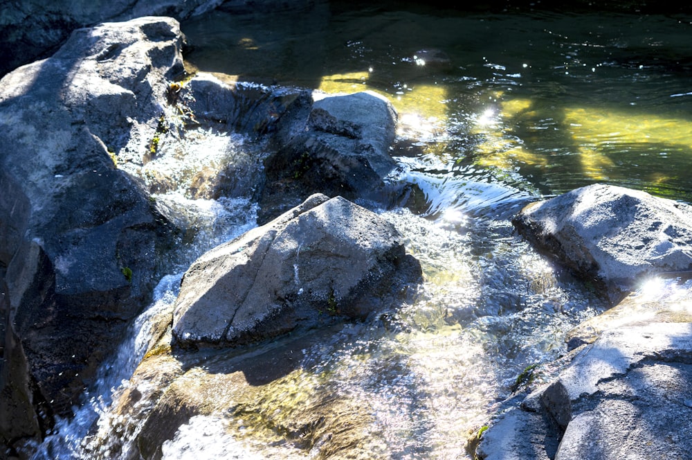 a stream of water running between two large rocks