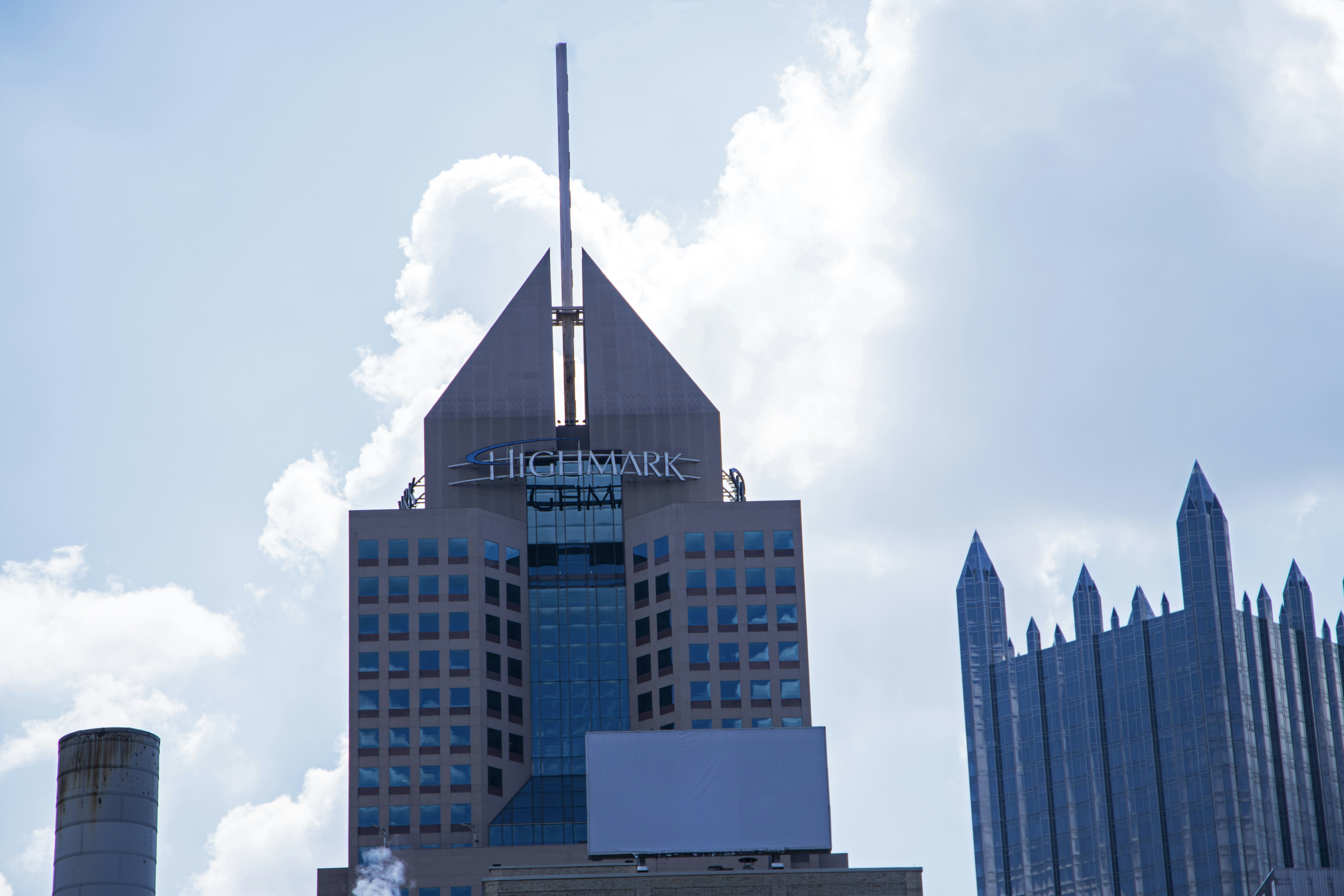 a tall building with a sky scraper on top of it