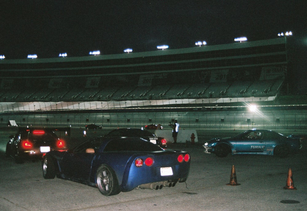 a couple of cars parked in a parking lot