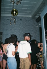 a group of people standing around in a room