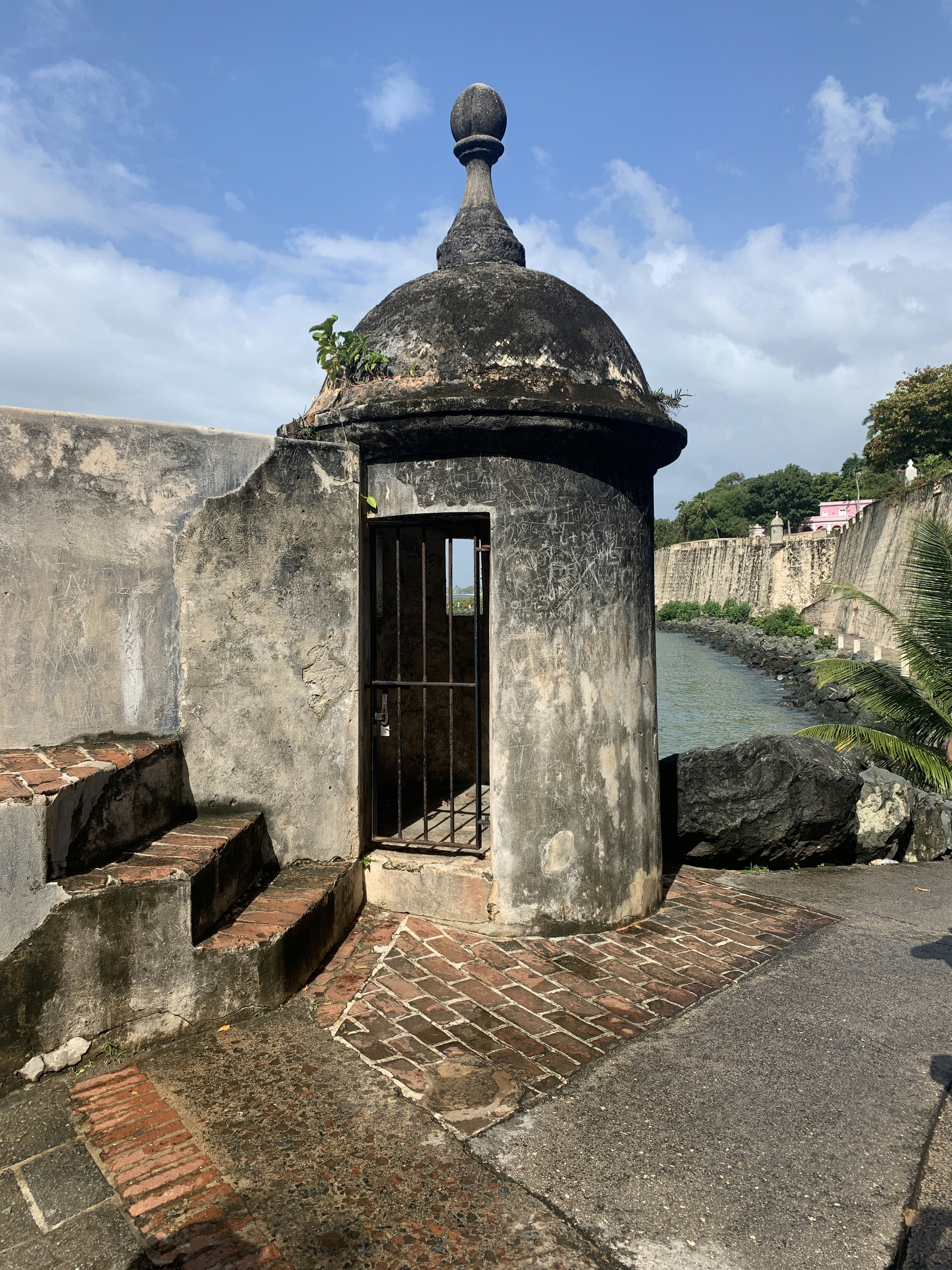 a stone building with a door and a window
