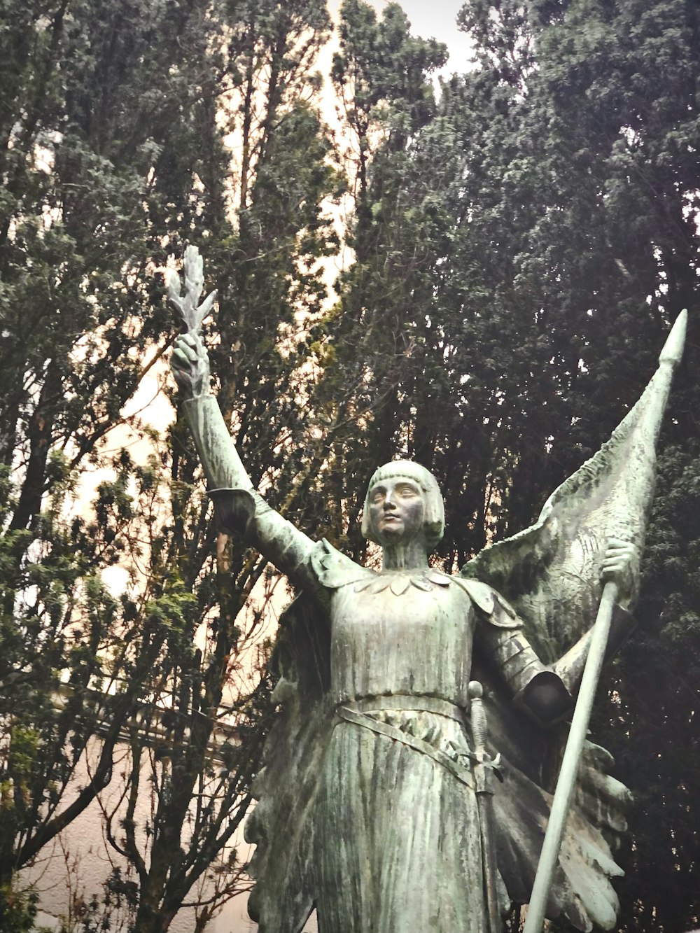 a statue of a woman holding a spear