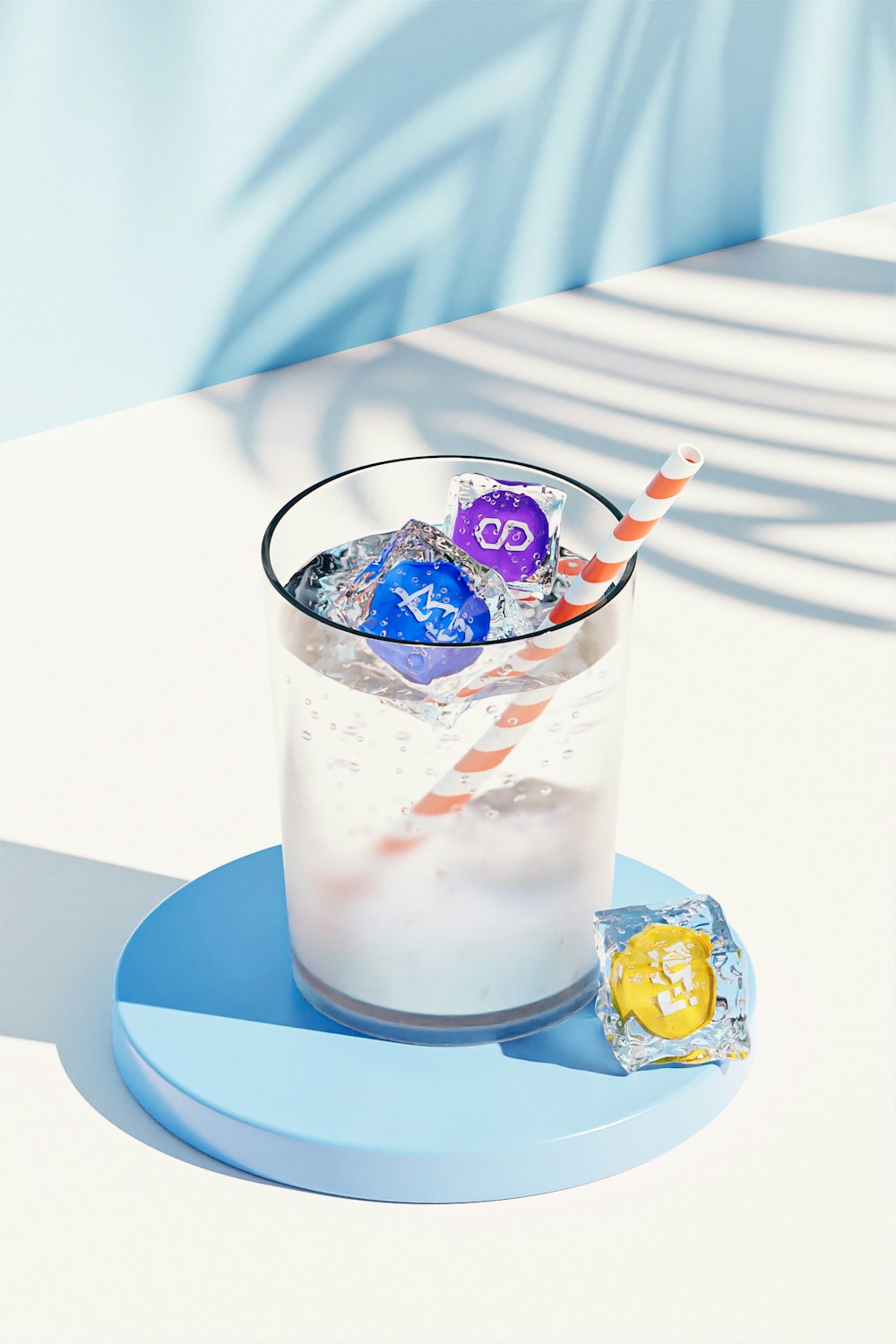 a glass filled with ice and candy on top of a table