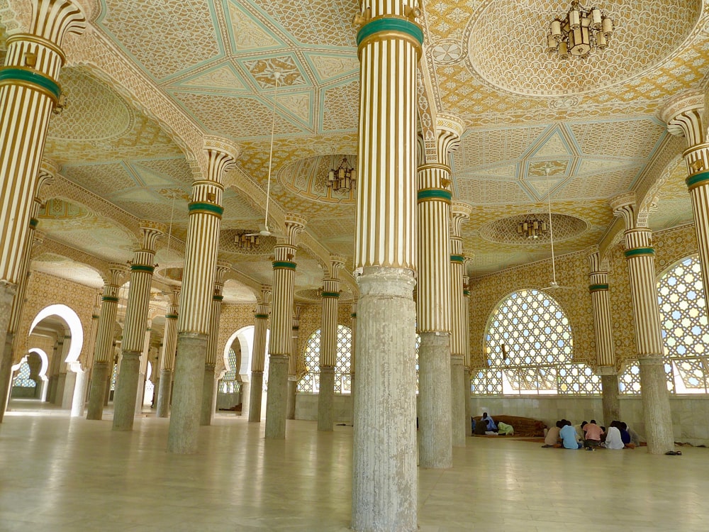 a group of people sitting in a large building