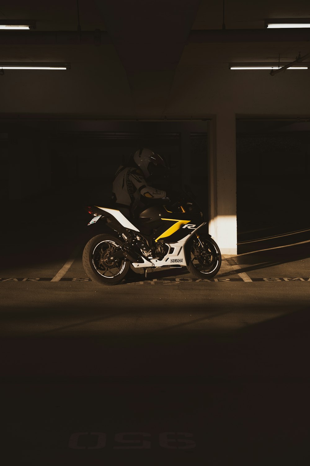 a motorcycle is parked in a parking garage