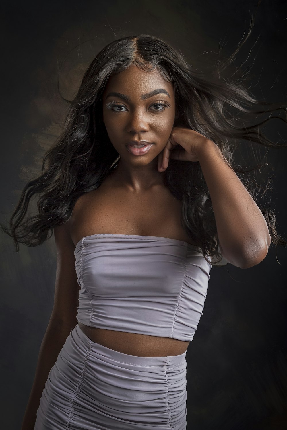 a woman with long hair posing for a picture