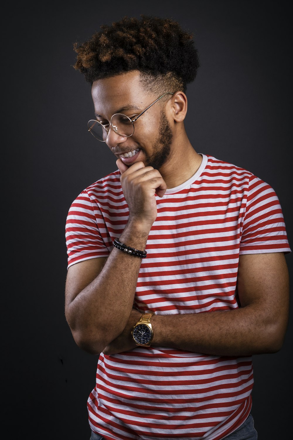 a man with glasses and a red and white striped shirt