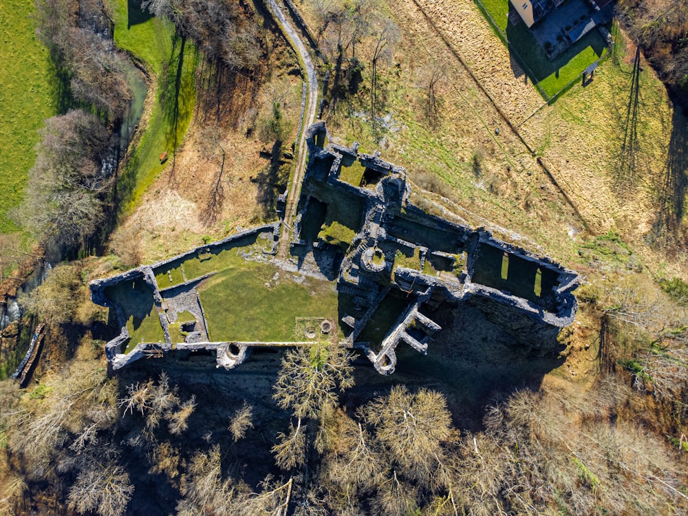 an aerial view of a castle in the middle of a field