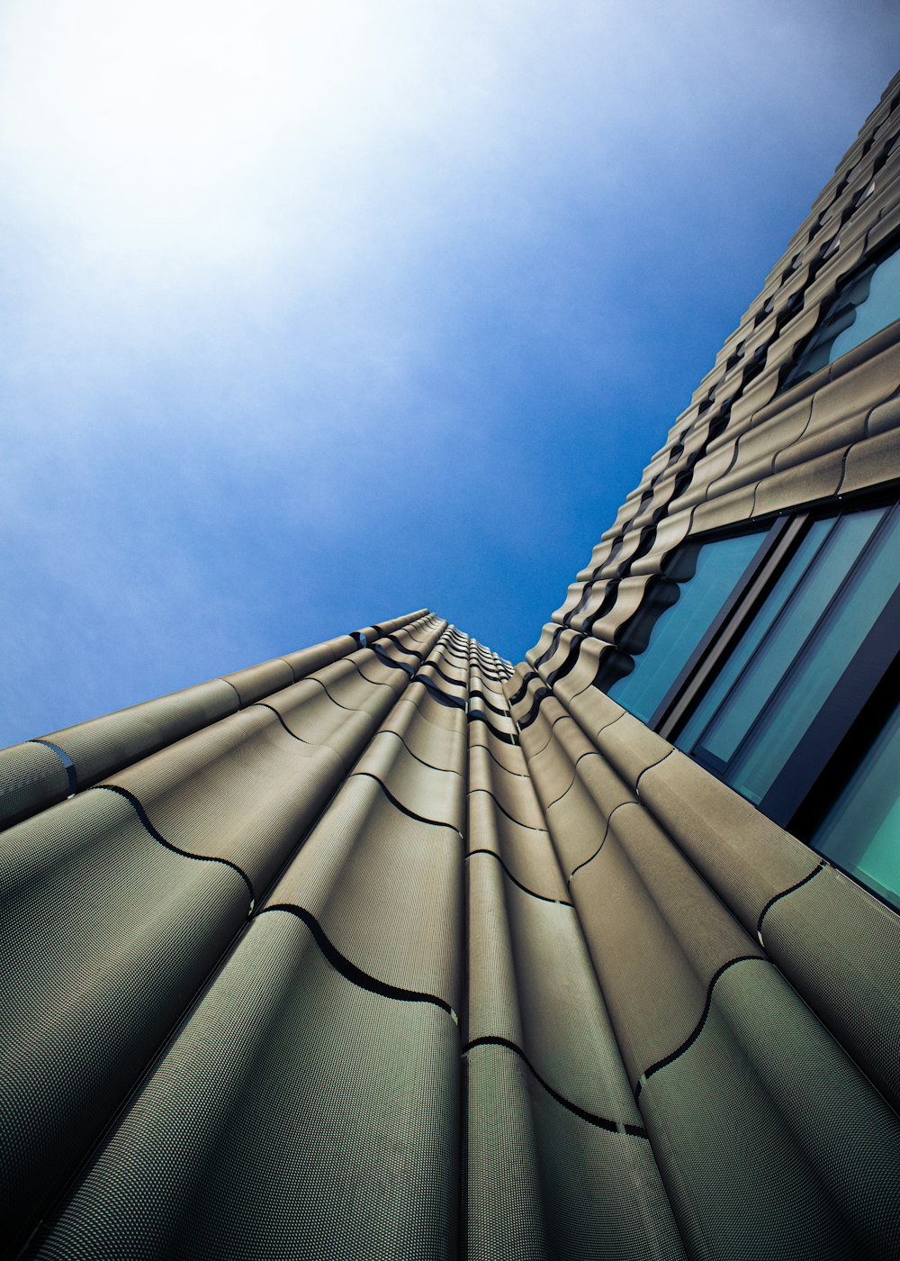 a tall building with a blue sky in the background