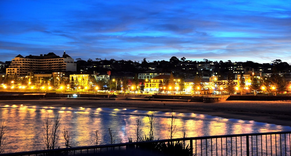 a view of a city at night from across the water