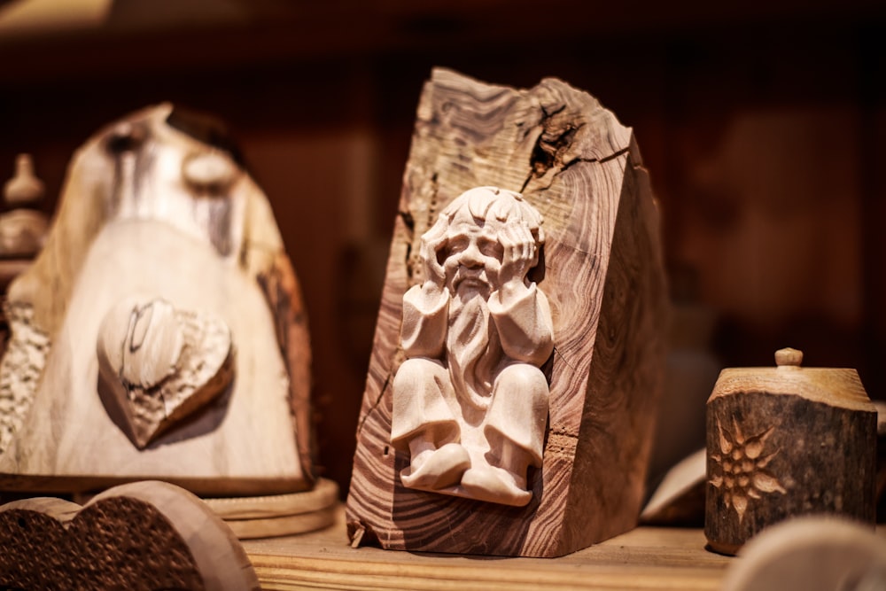 a wooden carving of a man with a beard